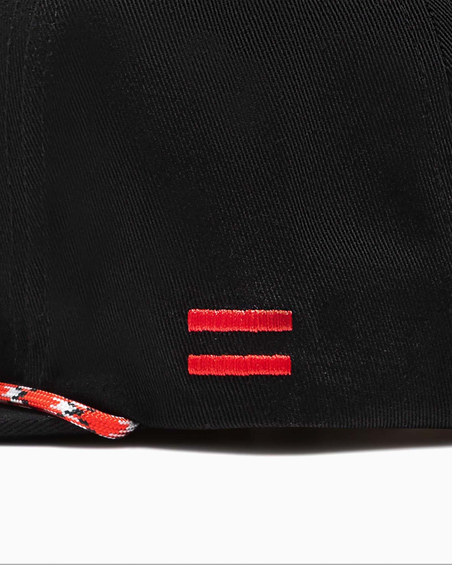 close up of side of hat with two red woven stripes