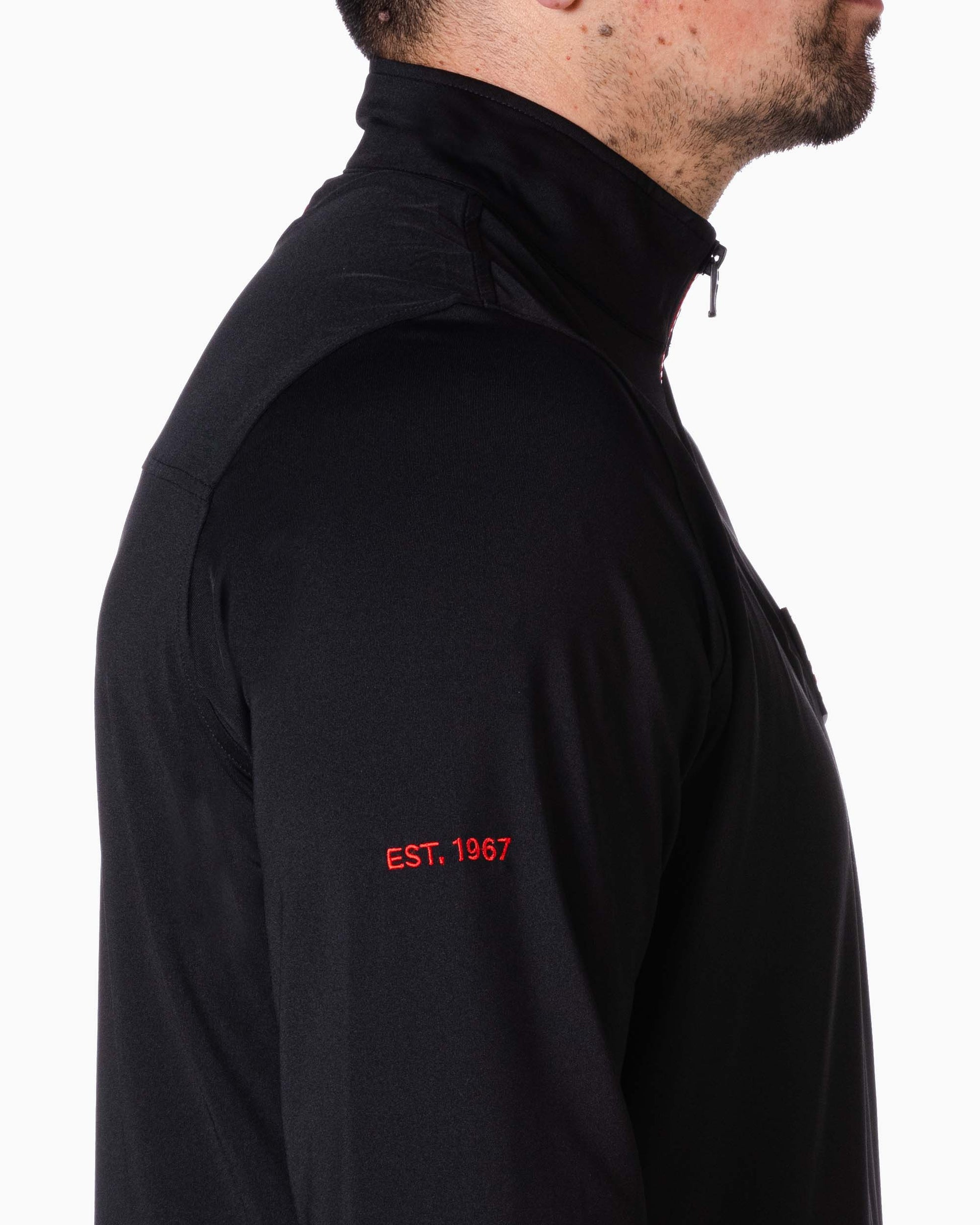 close up of sleeve with embroidered red "est. 1967"
