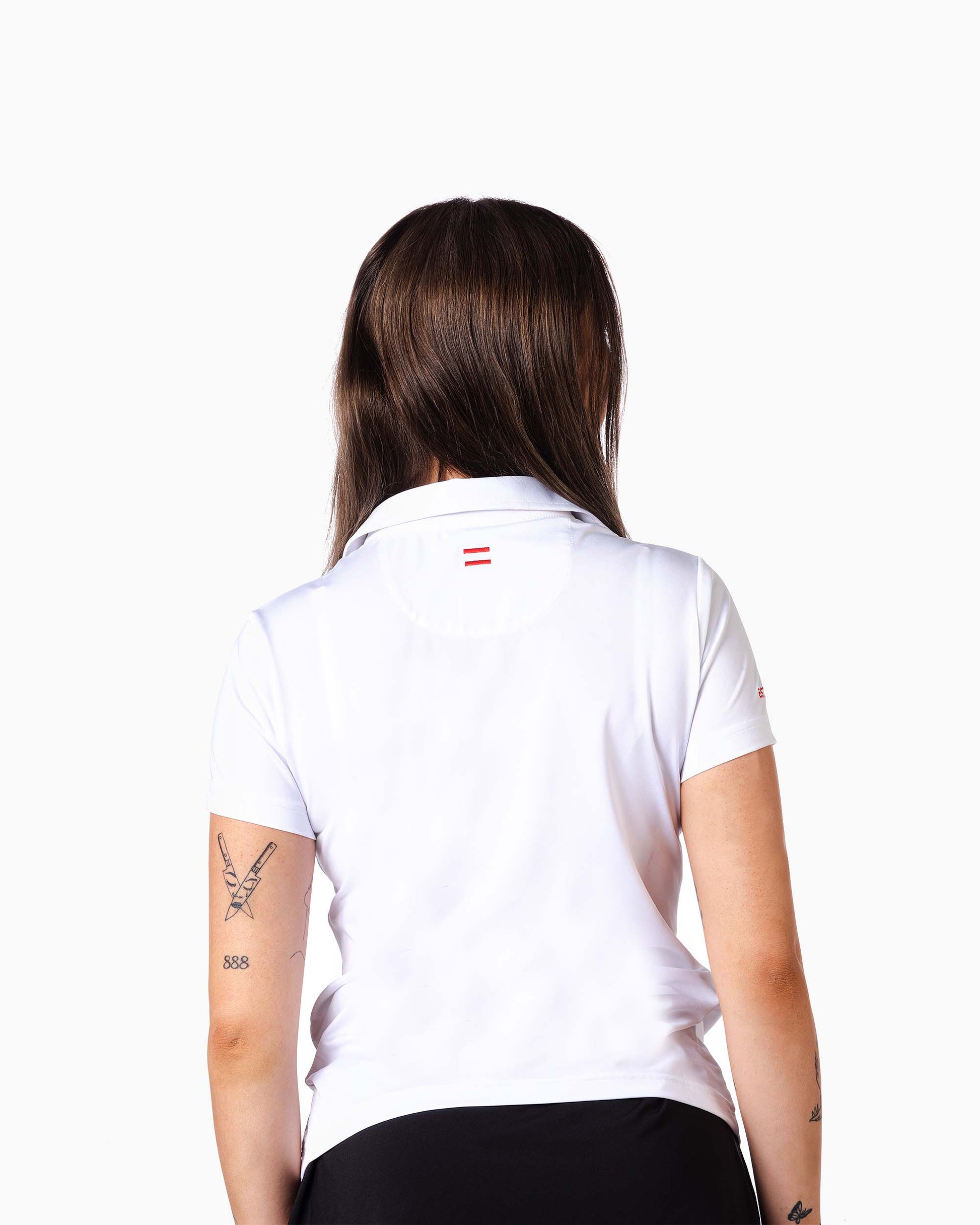 back of woman wearing white polo with two red woven stripes on neck
