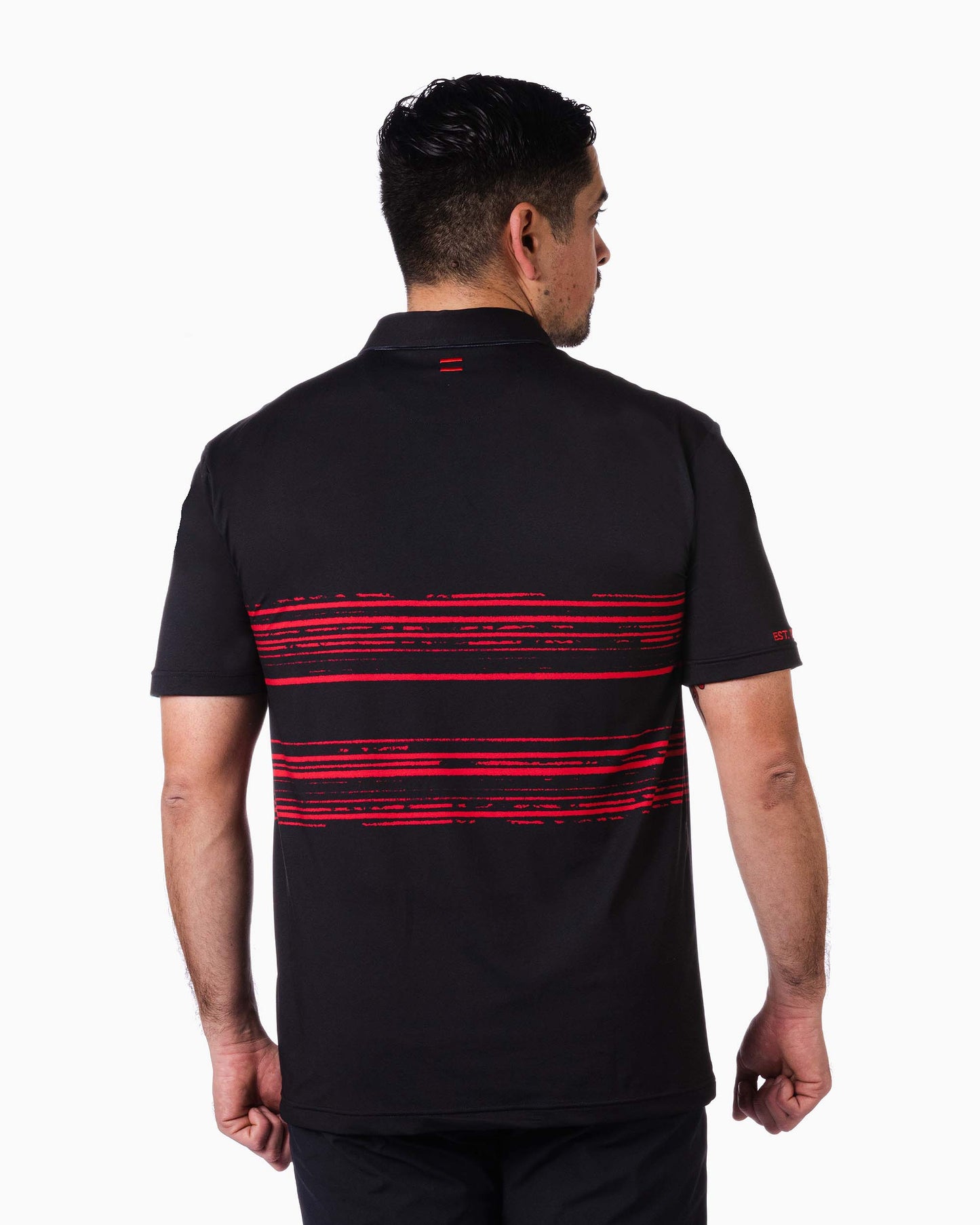 back of man wearing polo with two red woven stripes on top