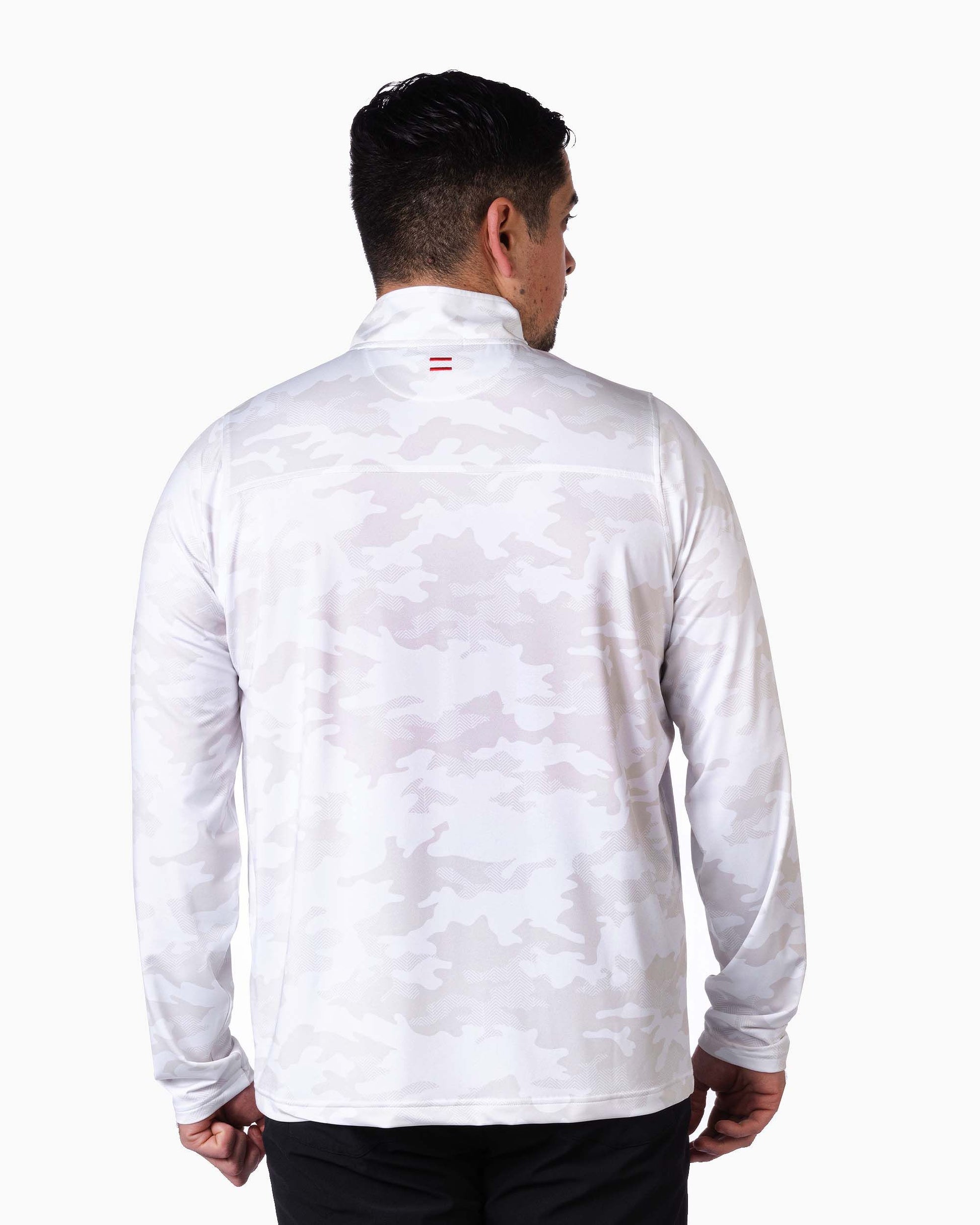 back of man wearing white camouflaged quarter zip with two red woven stripes on top